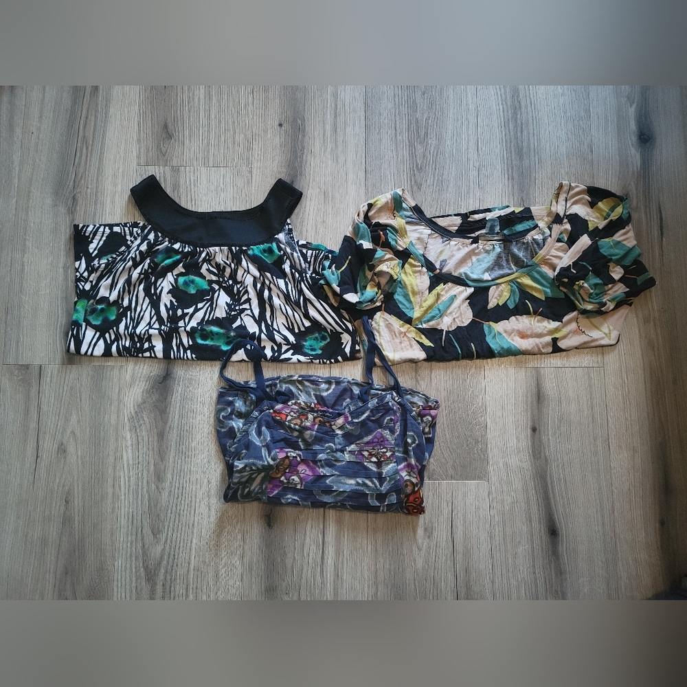 Used but in Fair condition! Bundle of three floral print tops